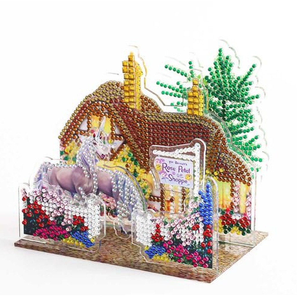 3D-billede af 2 enhjørninger foran hus (B)