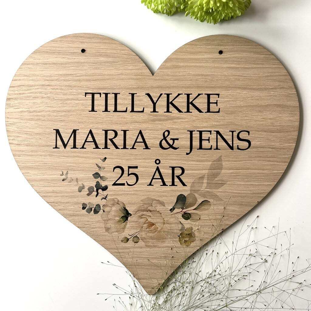 Hjerte æresportskilt med en buket af blomster